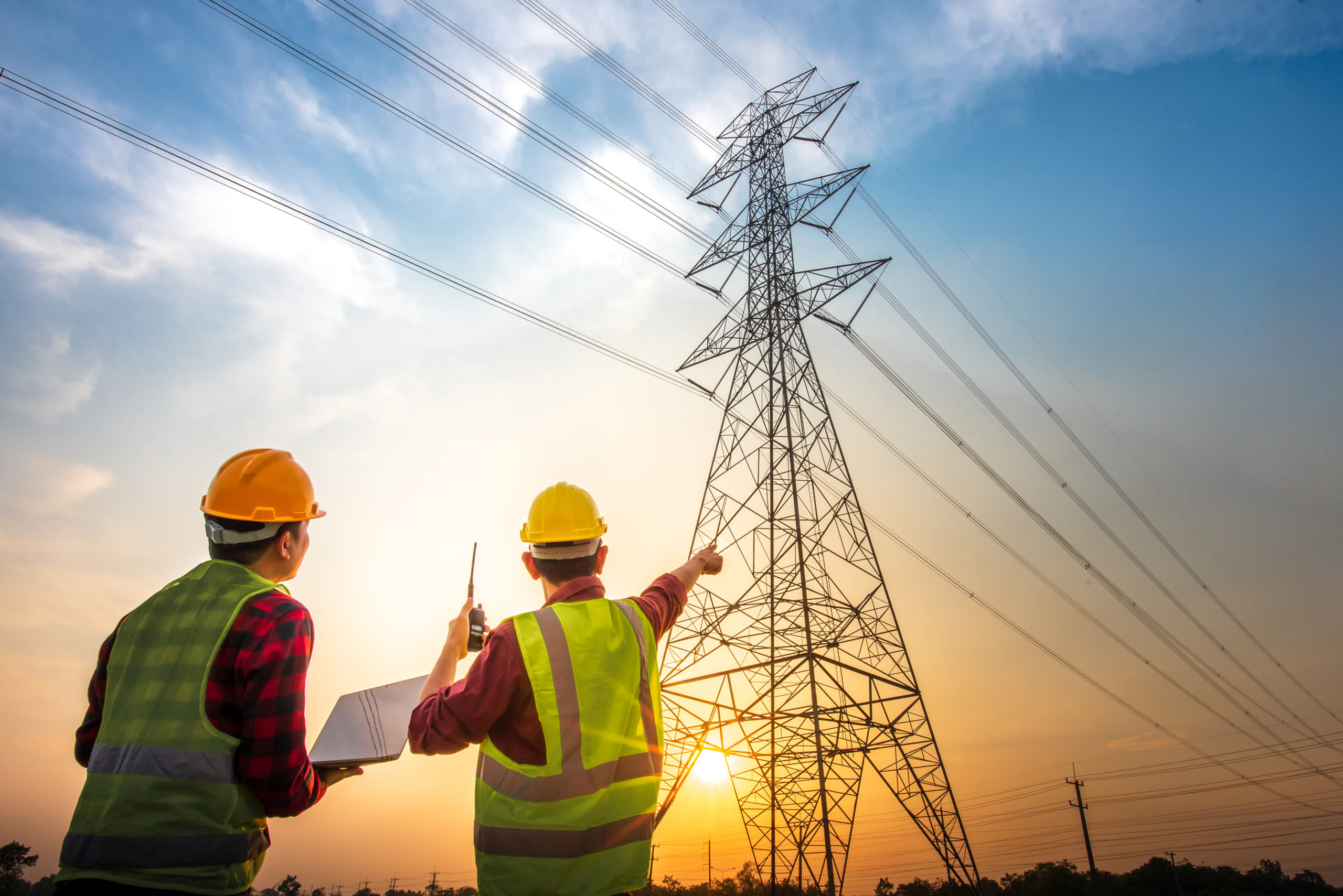 Picture of two electrical engineers checking electrical work usi