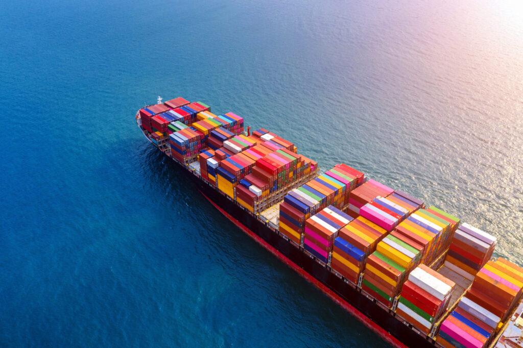 Aerial view of container cargo ship in sea.