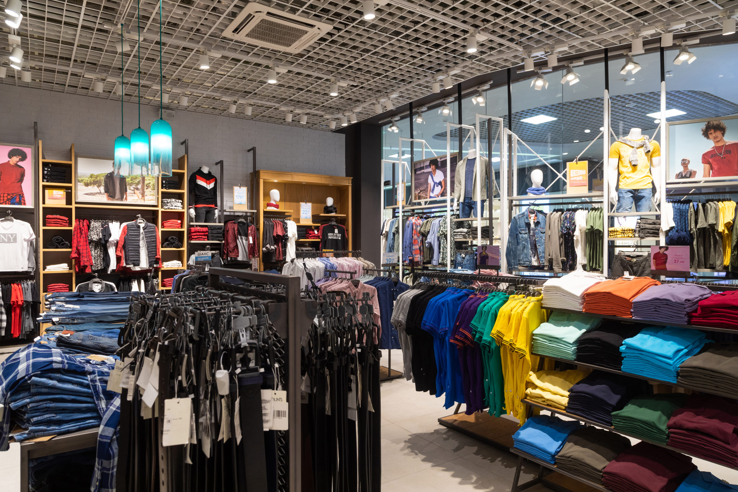 Minsk, Belarus - May 29, 2019: interior shot of racks with shirts, undershirts and jeans