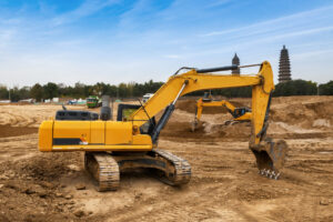 Excavators excavate earth at the construction site