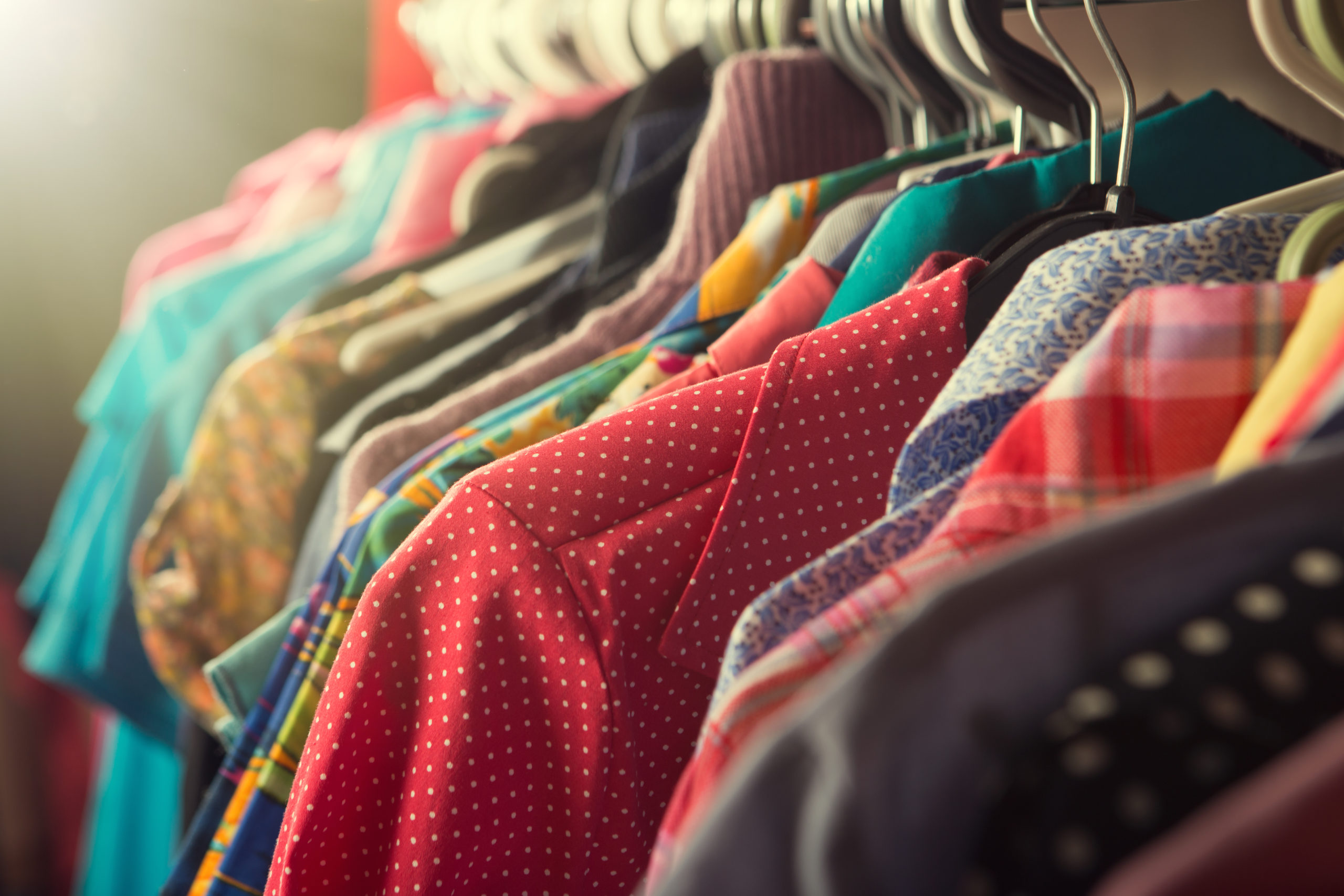 Clothes hanging on the rack in the fashion store